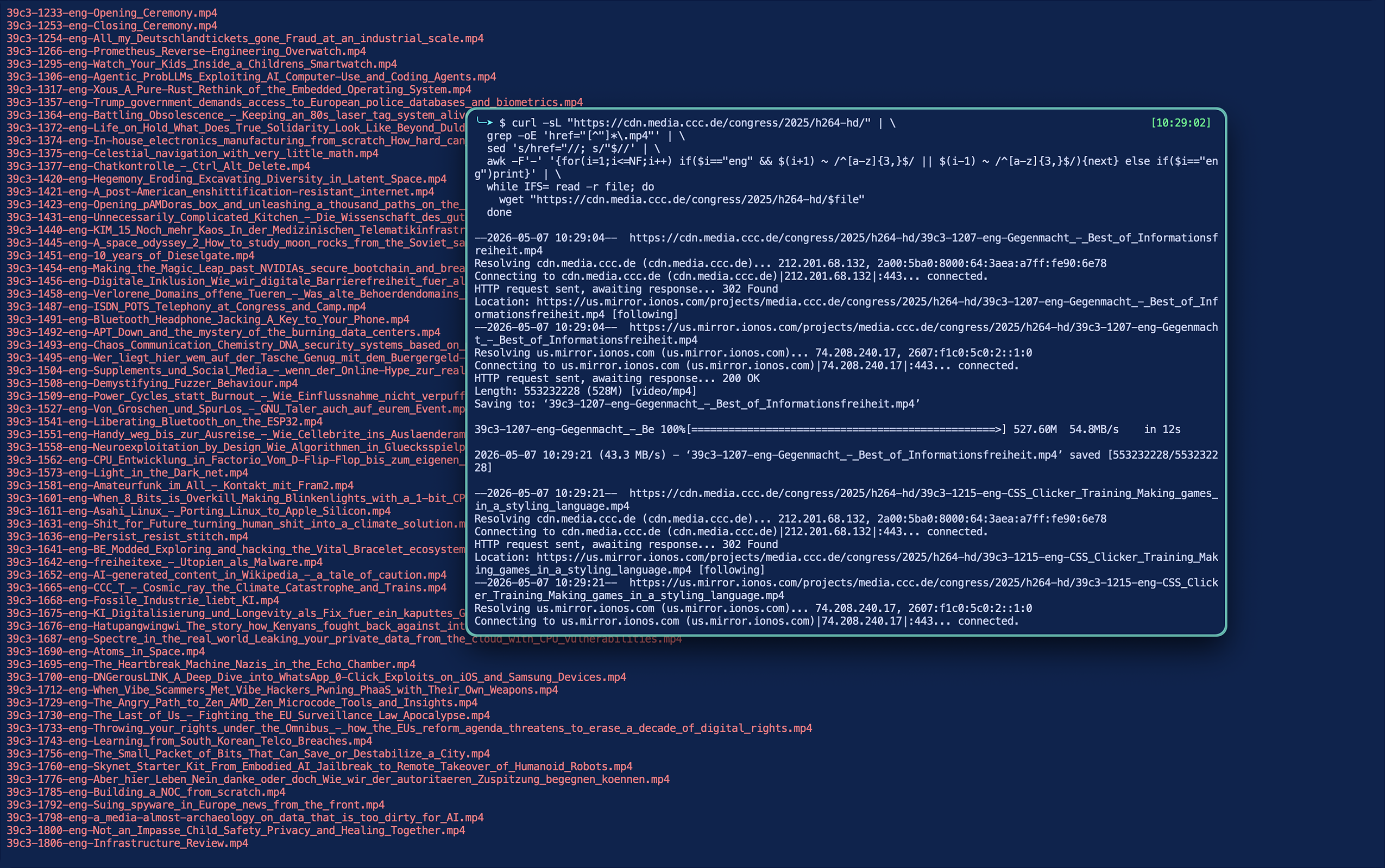 console output. one big console window with filenames of talks at 39c3. the smaller console window is layered above and has the command run to do the downloads, and output from a couple downloads below it
